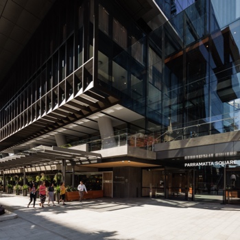 Tenants walking through the public domain towards one of the tower entrances at Parramatta Square.